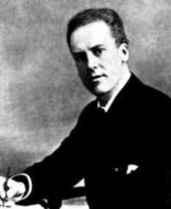 Portrait of Karl Pearson seated, writing.