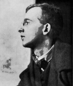 Profile of head and shoulders of Wilfrid Gibson circa 1913 modified from an original photograph