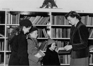 Me, clutching a book, at the opening of a new children's library around the time of writing the letter to my grandfather circa 1956