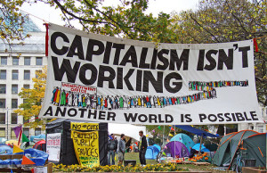 banner on site of Occupy London, 2011. 'Capitalism isn't working. Another world is possible'. Photo by Judy Greenway.