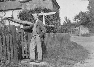 Wilfrid Gibson, around 1913, standing outside his house near Dymock.